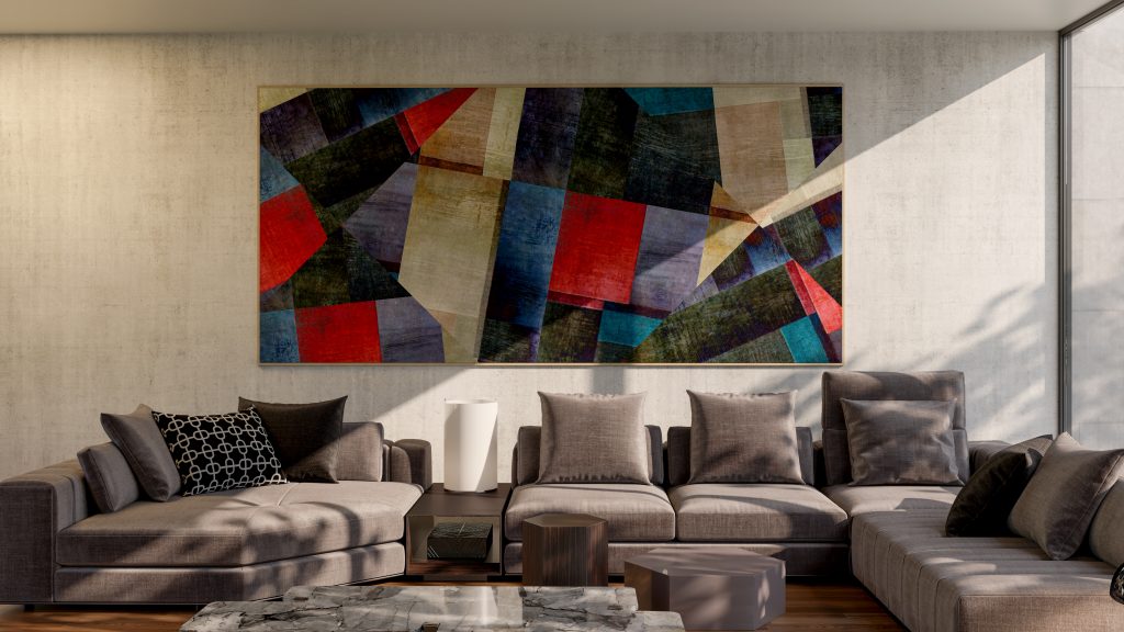 Sala de estar moderna com sofá em L cinza, almofadas em tons neutros, mesa de centro de mármore e quadro abstrato colorido na parede.