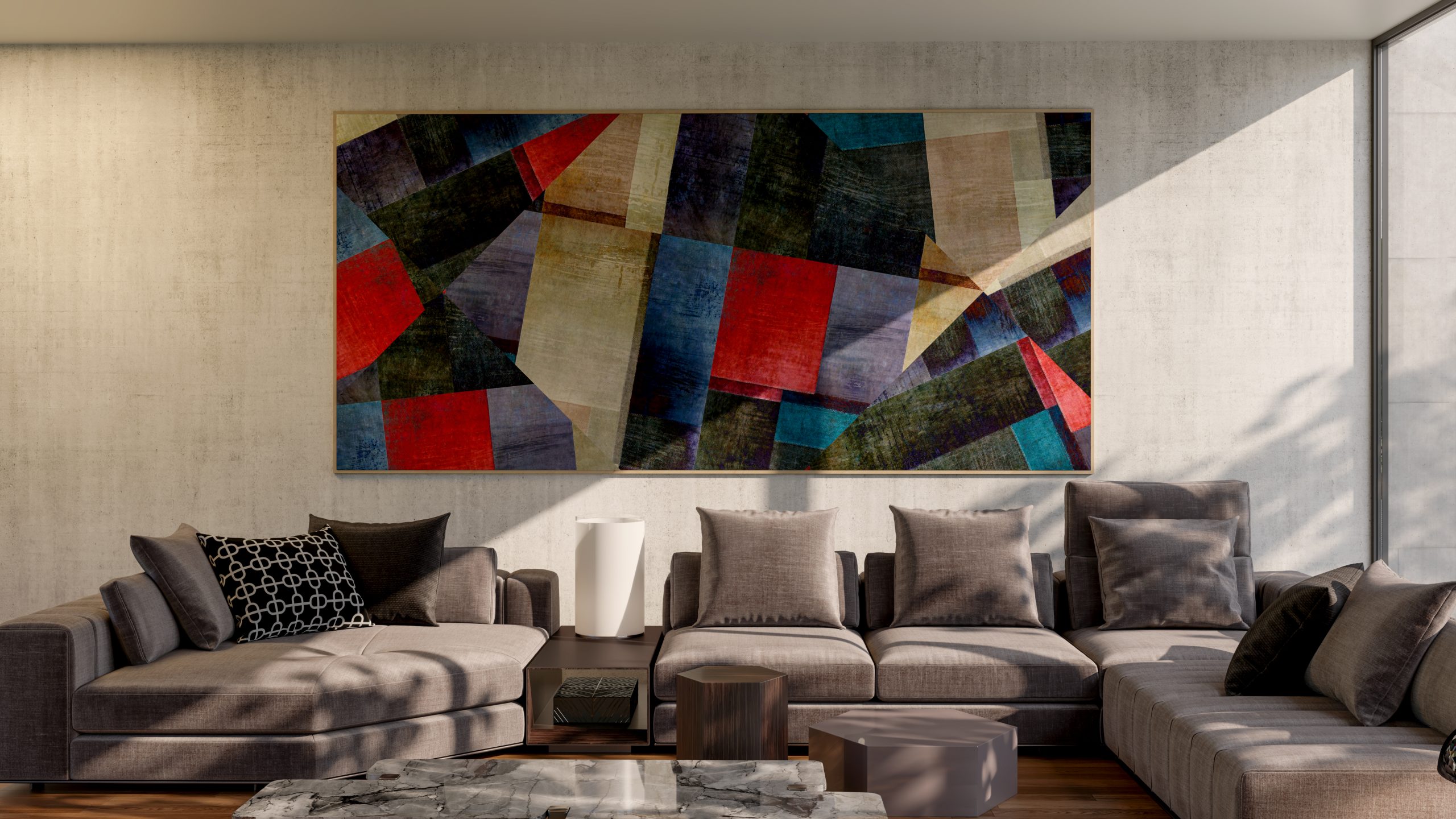 Sala de estar moderna com sofá em L cinza, almofadas em tons neutros, mesa de centro de mármore e quadro abstrato colorido na parede.